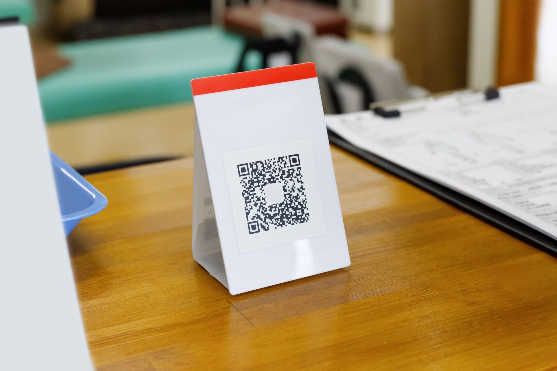 Cashless payment in hospitals and clinics. QR codes on wooden counters.